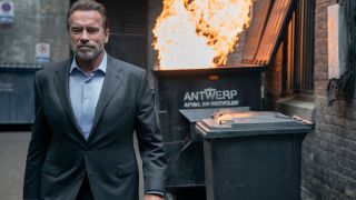 Arnold Schwarzenegger walking away from a literal dumpster fire in FUBAR.