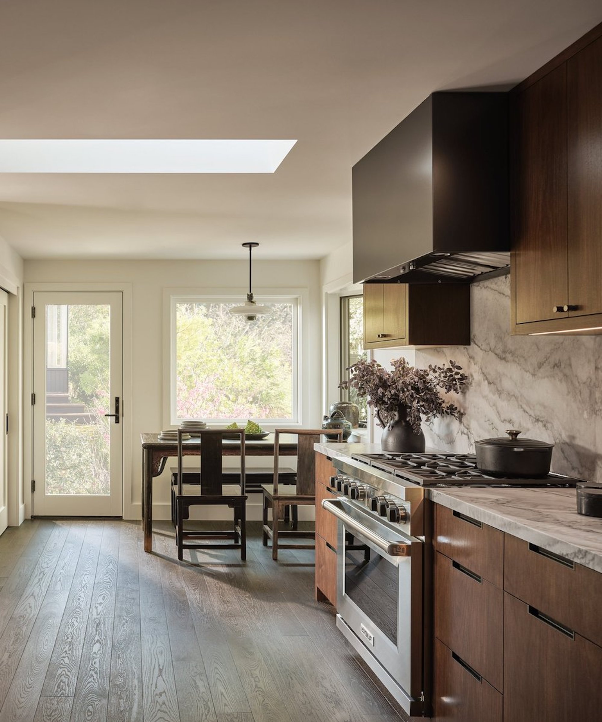 wood and marble kitchen with wood flooring