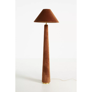 A brown floor lamp