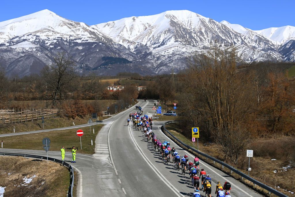 BELLANTE ITALY MARCH 10 A general view of the peloton passing through a snowy mountain landscape during the 57th TirrenoAdriatico 2022 Stage 4 a 202km stage from Cascata delle Marmore to Bellante 345m TirrenoAdriatico WorldTour on March 10 2022 in Bellante Italy Photo by Tim de WaeleGetty Images