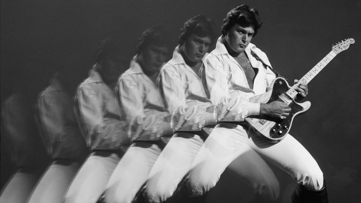 Multiple exposure studio portrait of Mick Green (1944-2010), Britiish rock and roll guitarist with Johnny Kidd &amp; The Pirates, playing the guitar, 1978. 