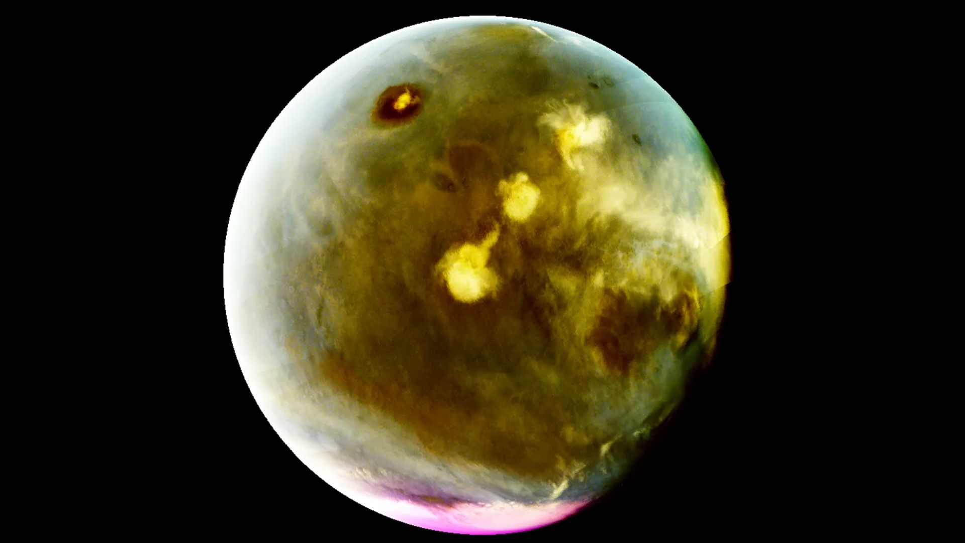 A false color image of Mars with pink areas on the bottom and greenish brown hues all over.