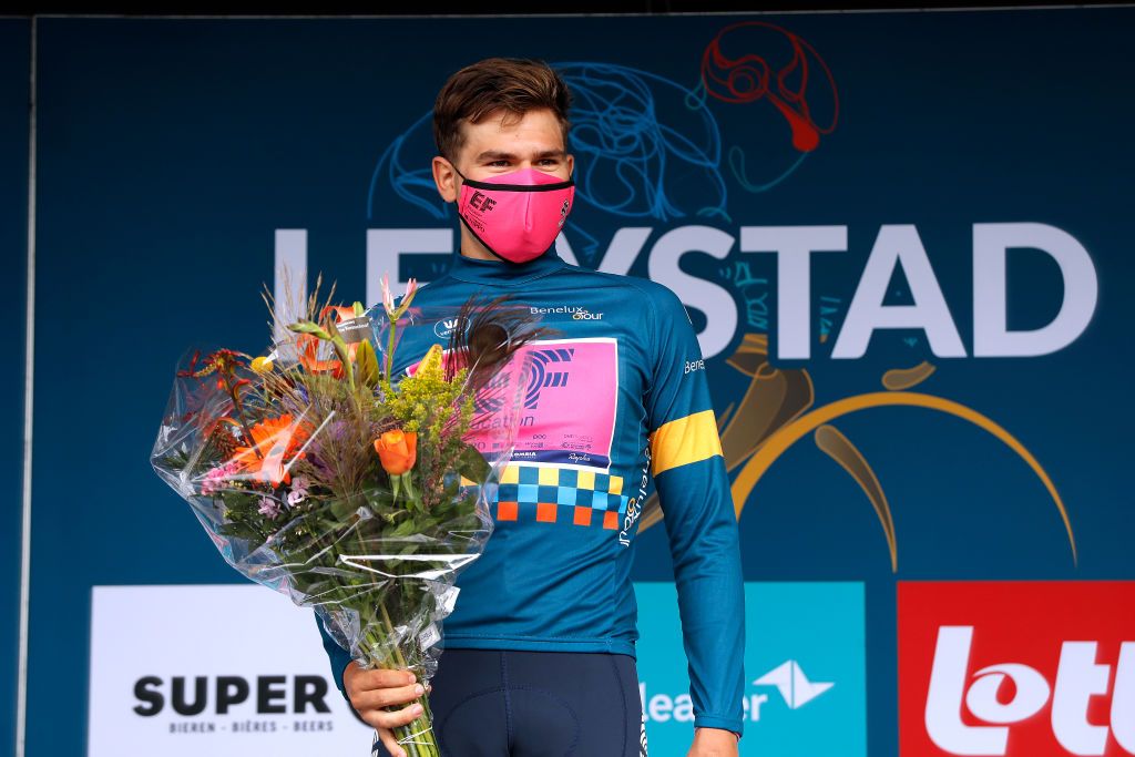 LELYSTAD NETHERLANDS AUGUST 31 Stefan Bissegger of Switzerland and Team EF Education Nippo celebrates winning the Blue Leader Jersey on the podium ceremony after the 17th Benelux Tour 2021 Stage 2 a 111km Individual Time Trial stage from Lelystad to Lelystad ITT BeneluxTour on August 31 2021 in Lelystad Netherlands Photo by Bas CzerwinskiGetty Images