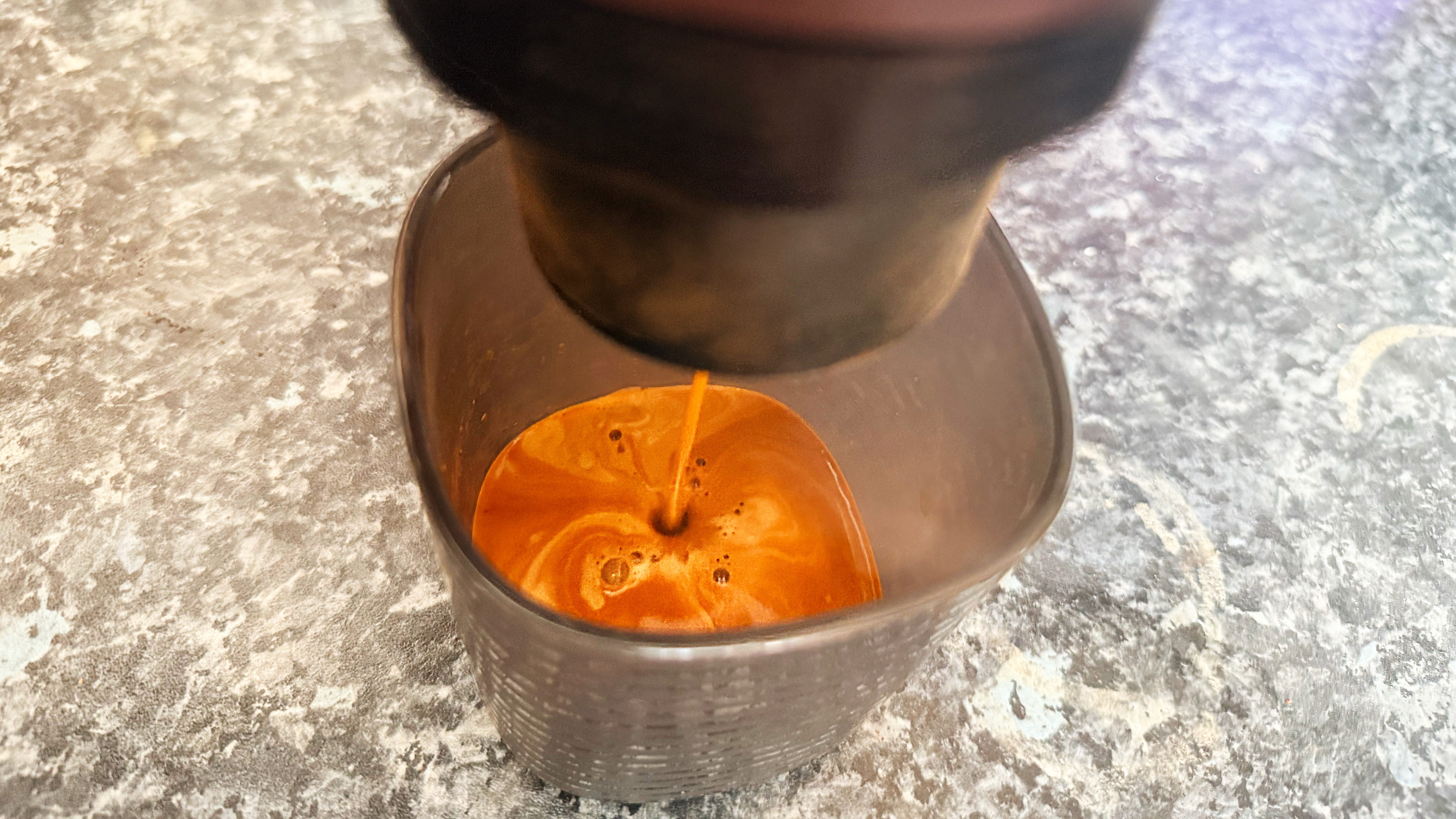 a photo of espresso made on the wacaco pixapresso showing a caramel-color crema