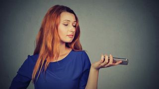Annoyed woman holding a smartphone