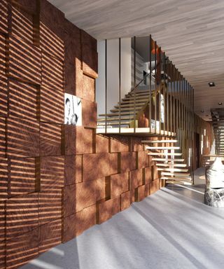 A wall with protruding wooden square blocks next to a staircase.