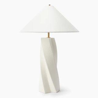 A white sculptural table lamp