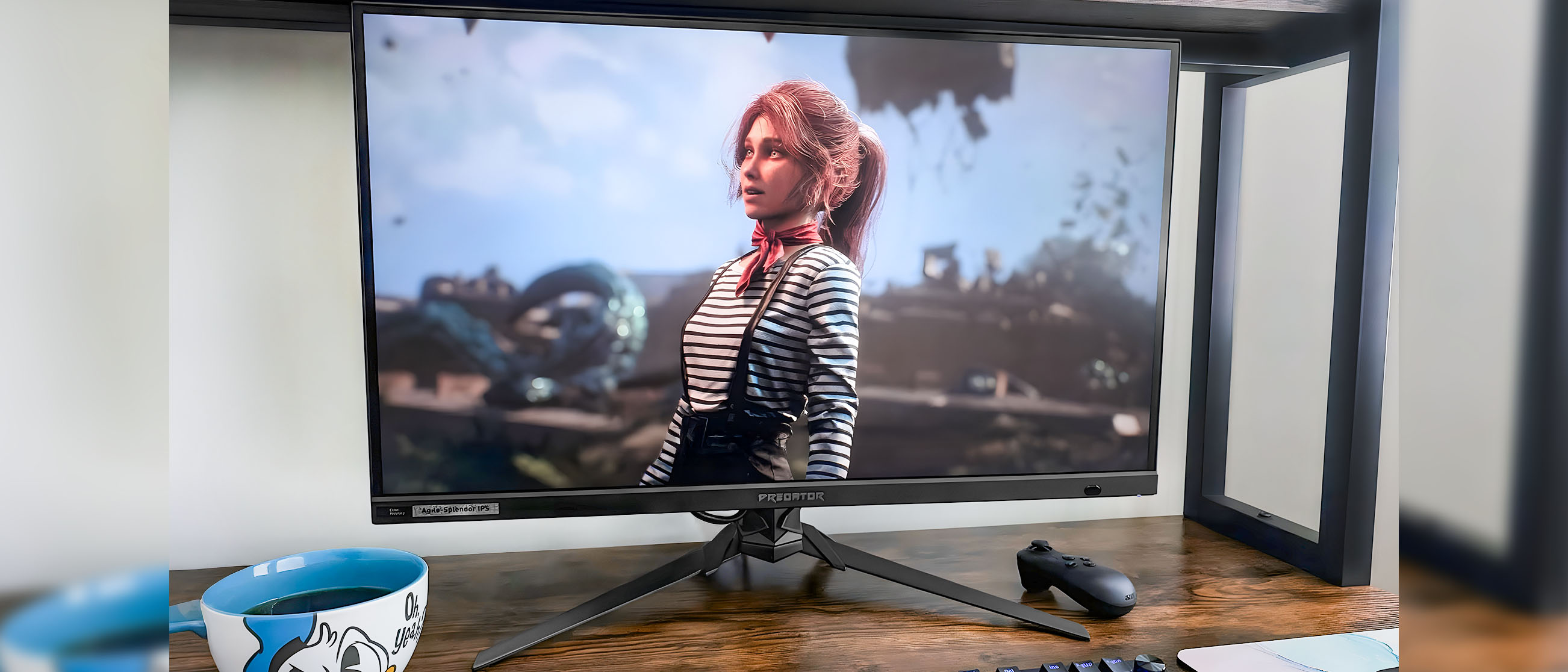 The Acer Predator XB273K monitor on a desk and displaying a scene with Maelle from Clair Obscur: Expedition 33. 