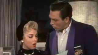 kathryn Grayson and Howard Keel looking at each other in Kiss Me, Kate.