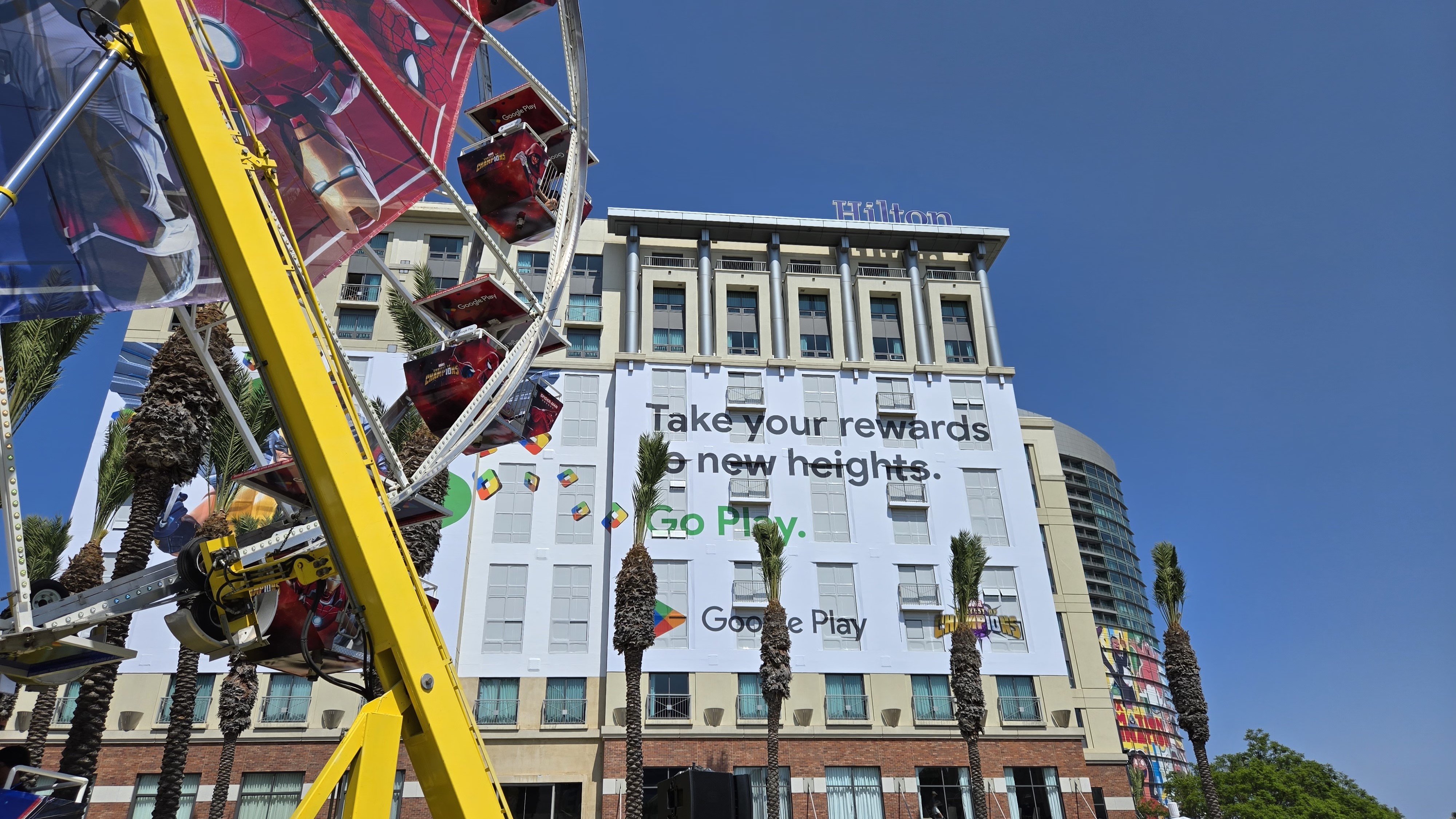 A large Google Play/Marvel poster on a building