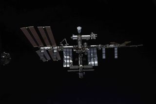 Another photo of the International Space Station shared by Novitsky on Twitter on Sept. 29, 2021. The SpaceX Crew Dragon capsule "Endeavour" is clearly visible, sticking "up" from the orbiting lab's Harmony module.