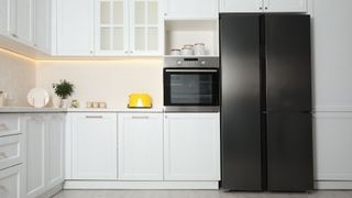 Where should a refrigerator go in the kitchen