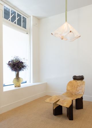 Installation view of Minjae Kim lounge chair, vase and ceiling lamp on show at Marta in Los Angeles