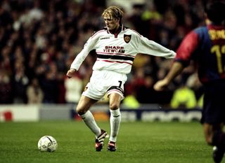 David Beckham in action for Manchester United against Barcelona in the Champions League in 1998.