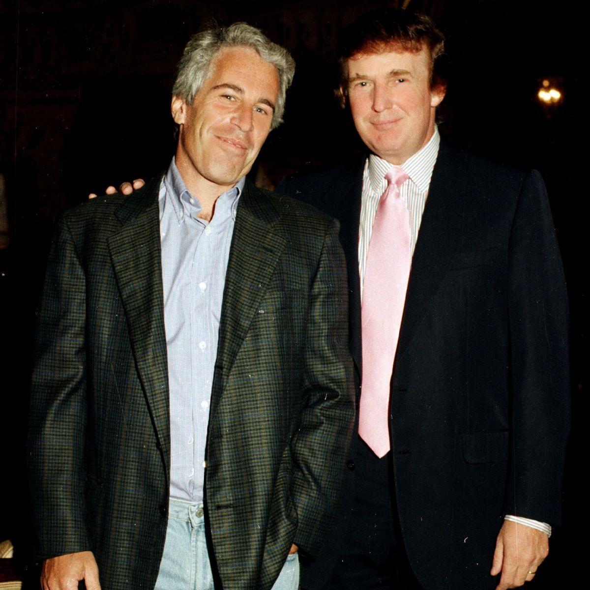 Portrait of American financier Jeffrey Epstein (left) and real estate developer Donald Trump as they pose together at the Mar-a-Lago estate, Palm Beach, Florida on February 22, 1997. (Photo by Davidoff Studios/Getty Images)