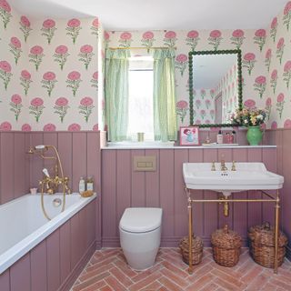 Pink bathroom with wall panelling and wallpaper