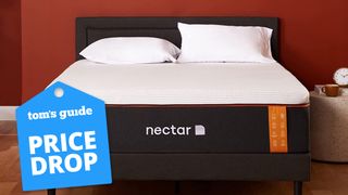 The Nectar Premier Copper Mattress shown against a red wall