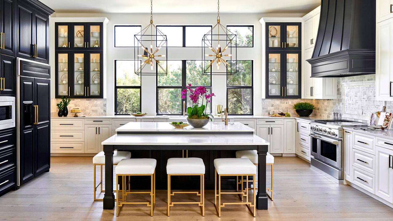 a large kitchen with an island and illuminated kitchen cabinets