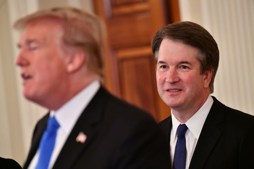 Supreme Court nominee Brett Kavanaugh listens to US President Donald Trump announcing his nomination.