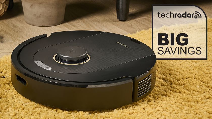 Roborock robot vacuum next to a Big Savings graphic