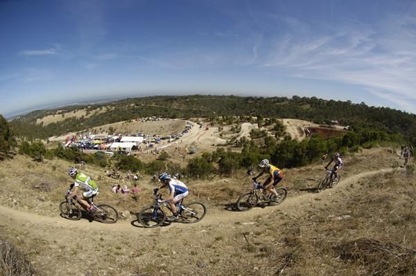 Cross country riders traverse the hill above the event village.