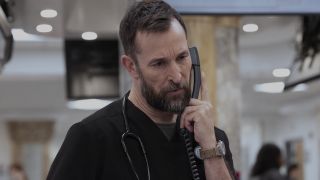 Robby on the phone in The Pitt 213