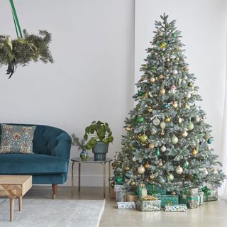 room with white walls and christmas tree