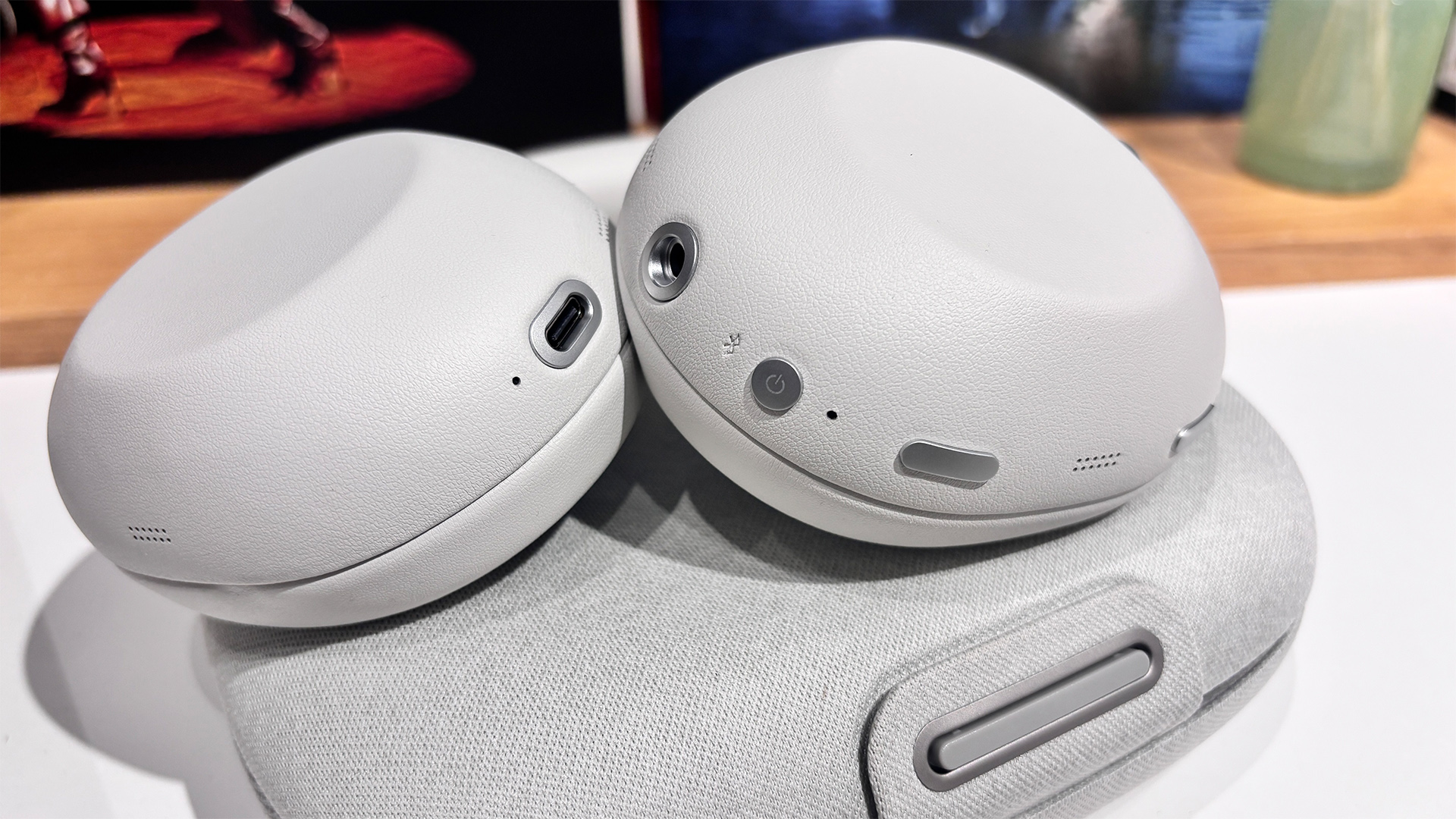 Sony 1000X The Collexion wireless headphones on top of case showing controls and connections