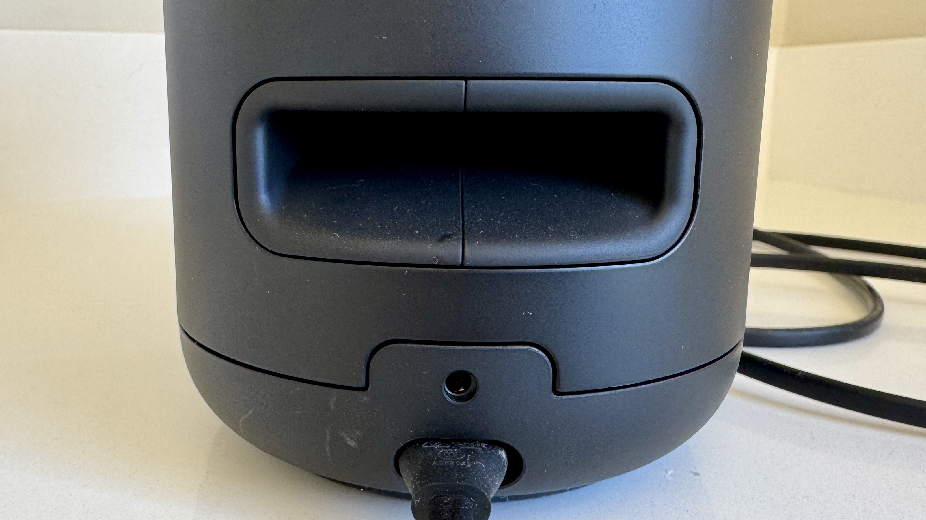 Bose Lifestyle Ultra speaker on a white table