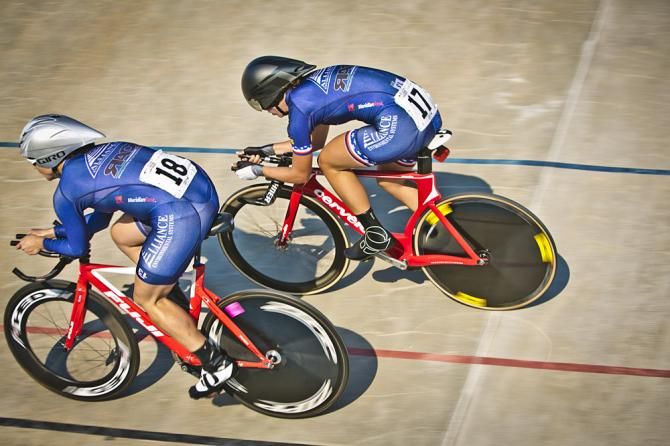 Kimberly Geist, number 17, passes and eliminates Julia Lonchar, number 18, in the gold medal round for the Individual Pursuit.