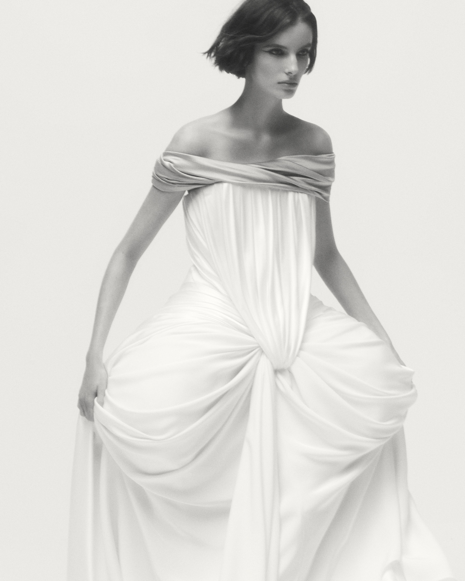 Model wears off-shoulder Dior dress