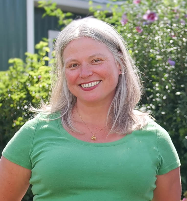 Woman headshot in green top