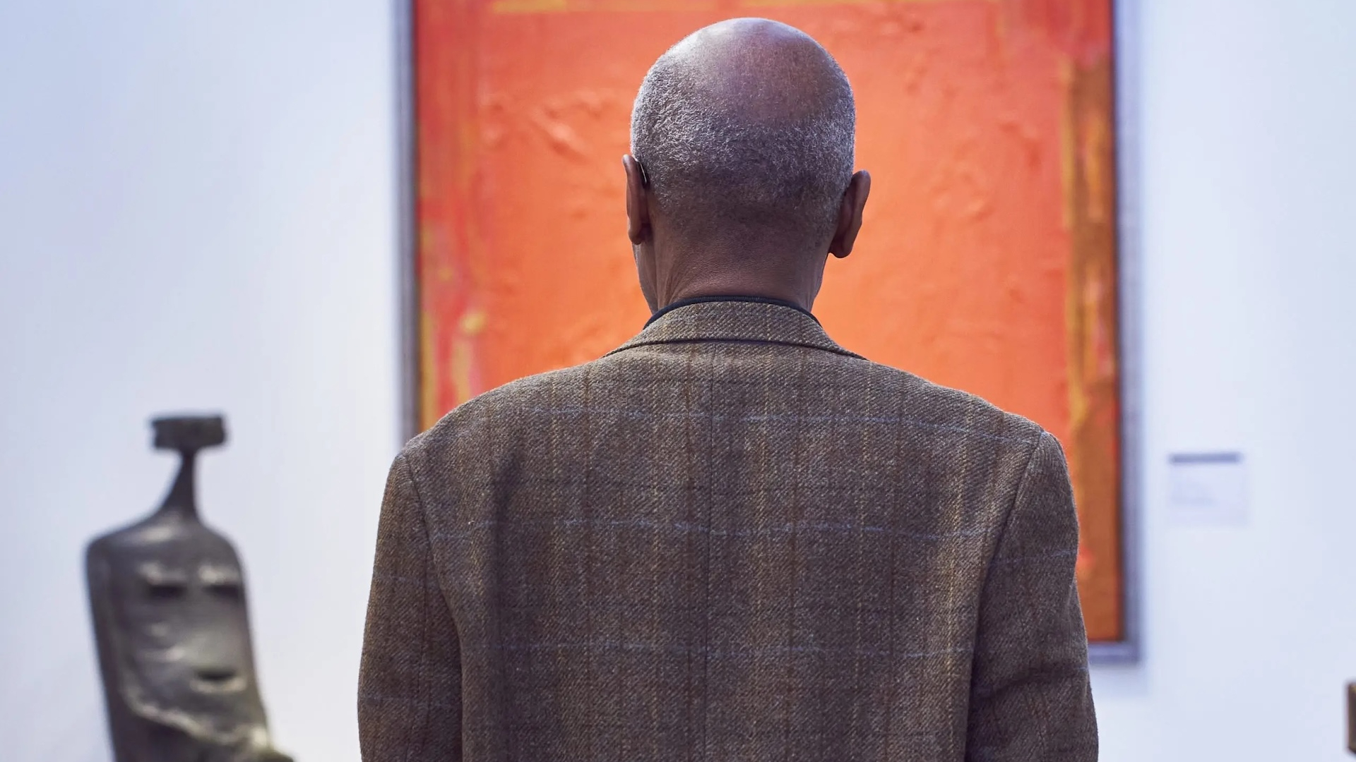 London Art Fair: Person looking at a painting 