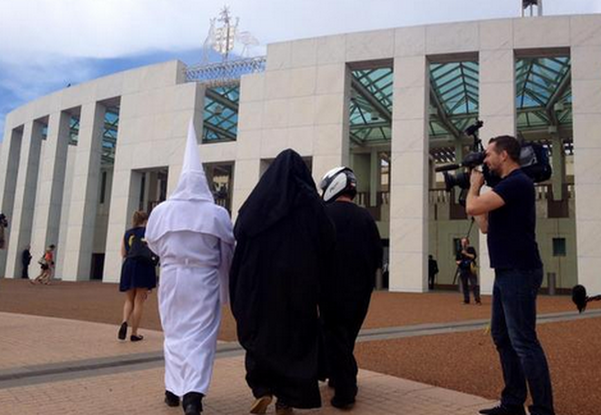 Anti-burqa protesters don KKK hoods, biker helmets at Australian Parliament