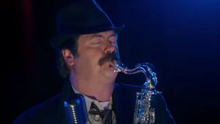 Nick Offerman as Ron Swanson, moonlighting as his alter-ego Duke Silver