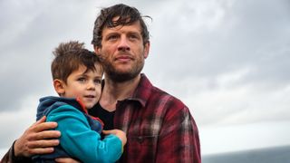 Pete and Theo looking out to sea in Playing Nice