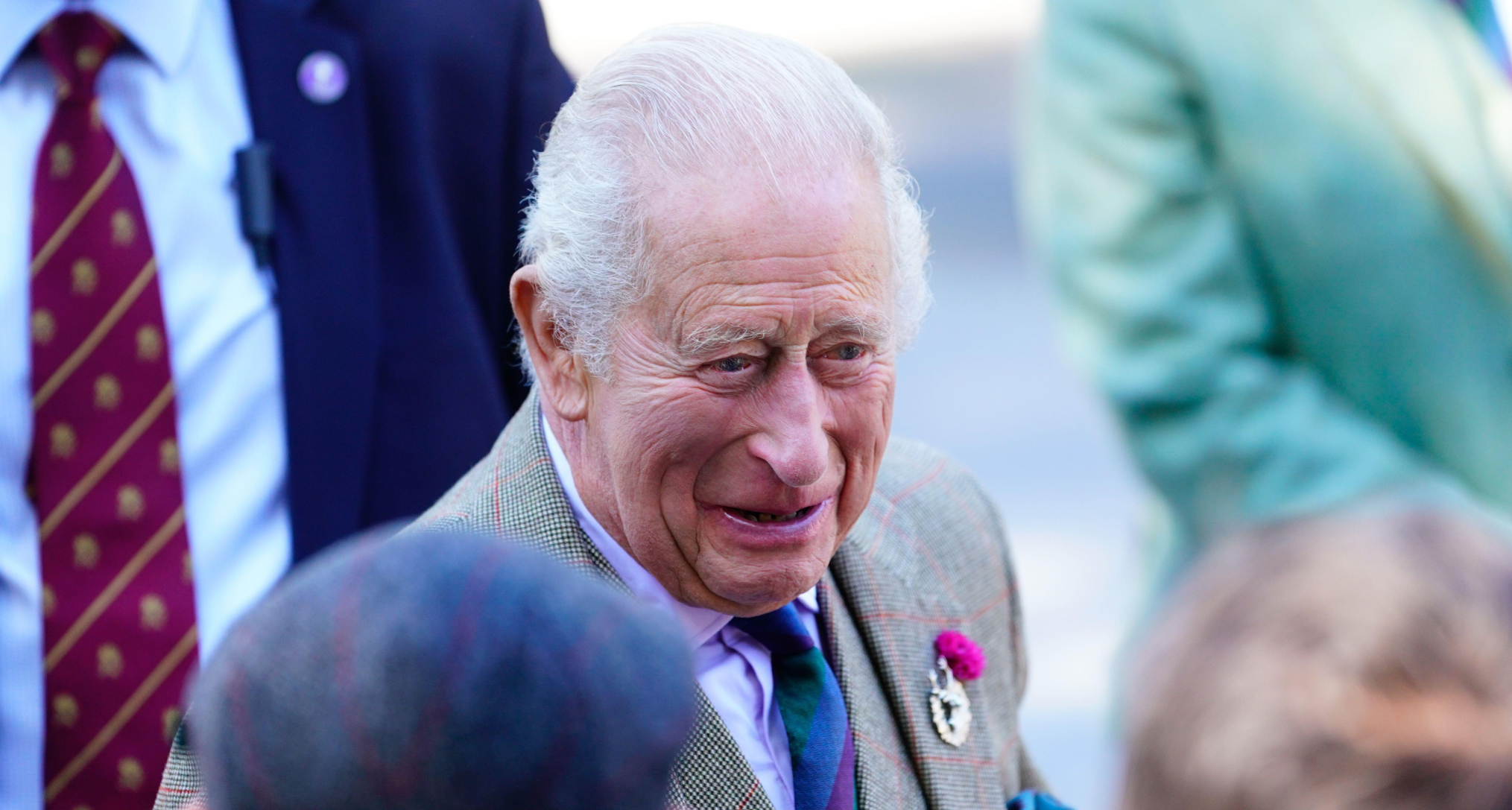 King Charles laughing as he talks to fans