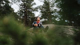 woman forest bathing in the Dolomites