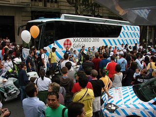 A popular team bus with the distinctive blue stripes.