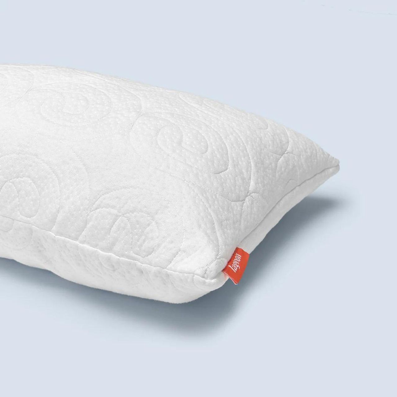 The Fox Pillow against a blue background.