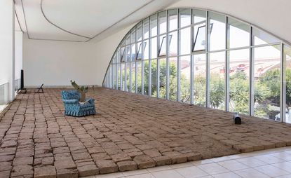 Rafa Esparza’s mud brick installation, tierra, offers an interactive experience on the mezzanine