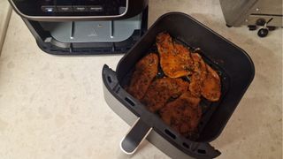 Before grilling chicken in the Ninja Air Fryer Pro 4-in-1