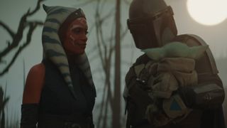 Din Djarin and Ahsoka Tano look at Baby Yoda in The Mandalorian season 2