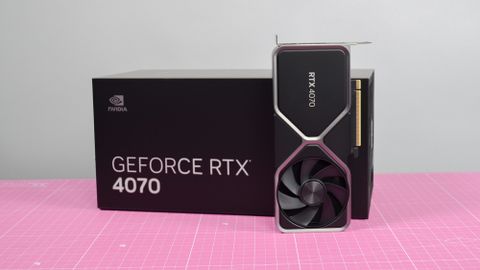 An Nvidia GeForce RTX 4070 graphics card standing upright next to its retail packaging