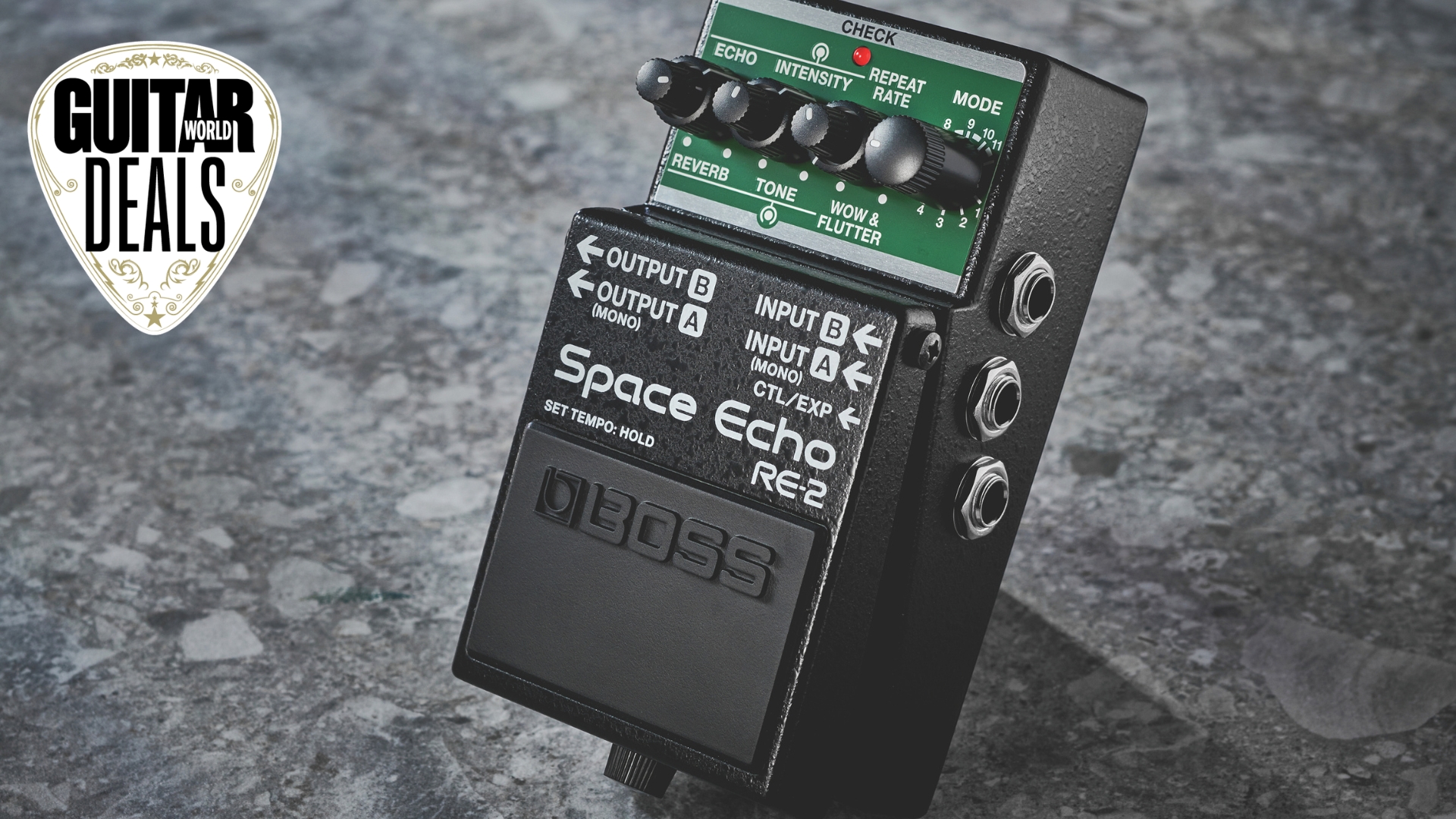 A Boss RE-2 Space Echo guitar pedal on dark surface with the Guitar World deals logo in the corner