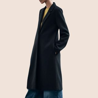 Flat lay image of black coat