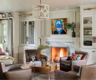 Living room with a fireplace and leather armchairs