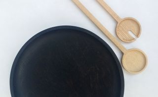 Black wood bowl with beech salad spoons