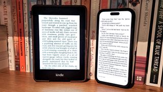 iPhone next to a kindle