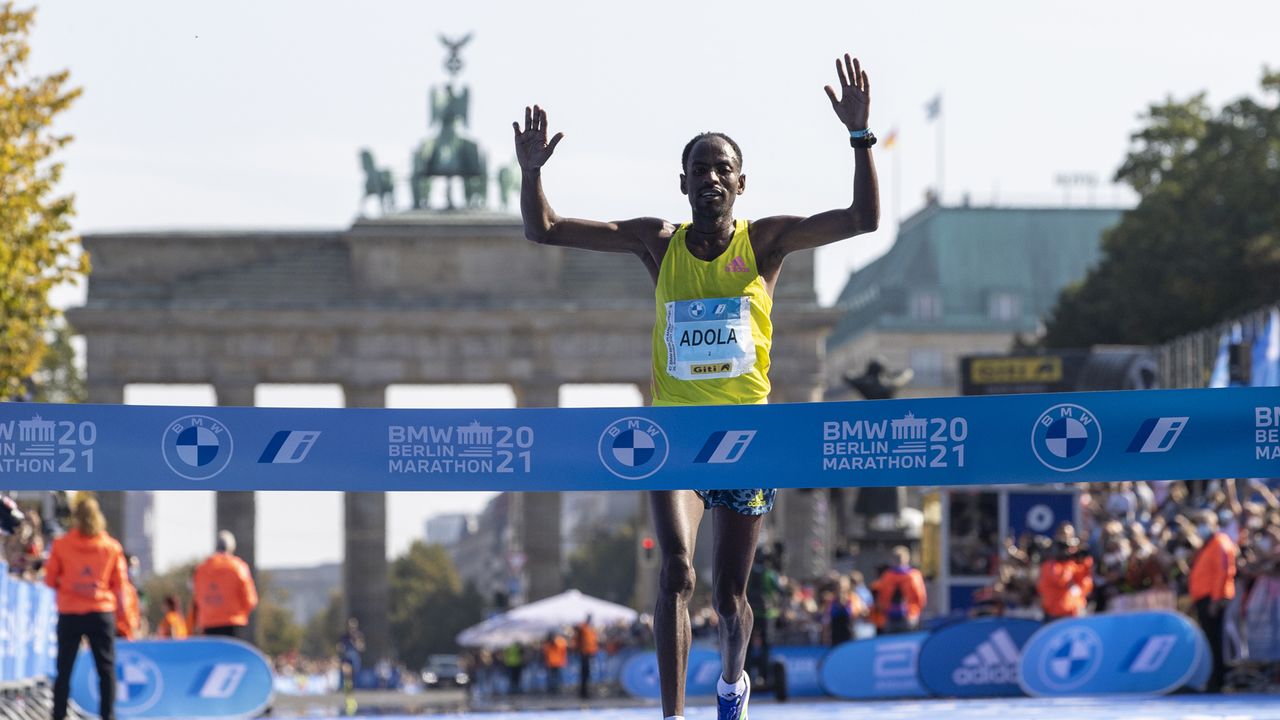 BERLIN, GERMANY - SEPTEMBER 26: Guye Adola of Ethiopia wins the Men&#039;s Elite race during the 47th Berlin Marathon 2021 on September 26, 2021 in Berlin, Germany. (Photo by Maja Hitij/Getty Images)